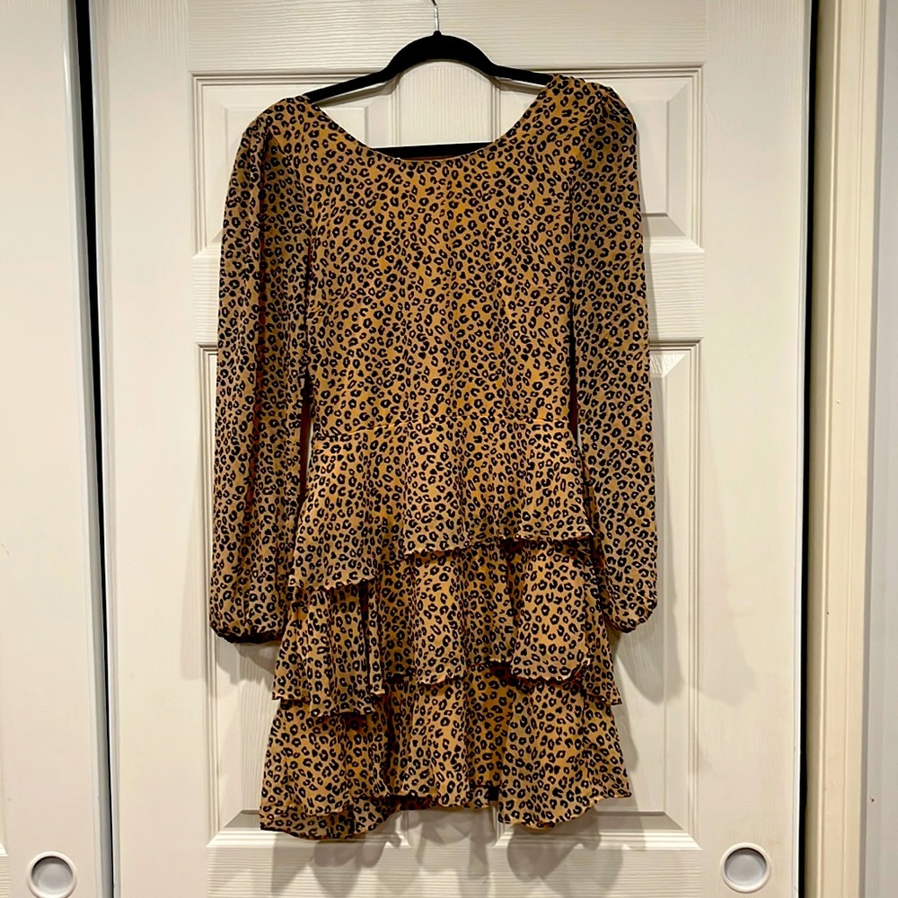 Gorgeous Leopard print mini dress with ruffles and long sleeves.